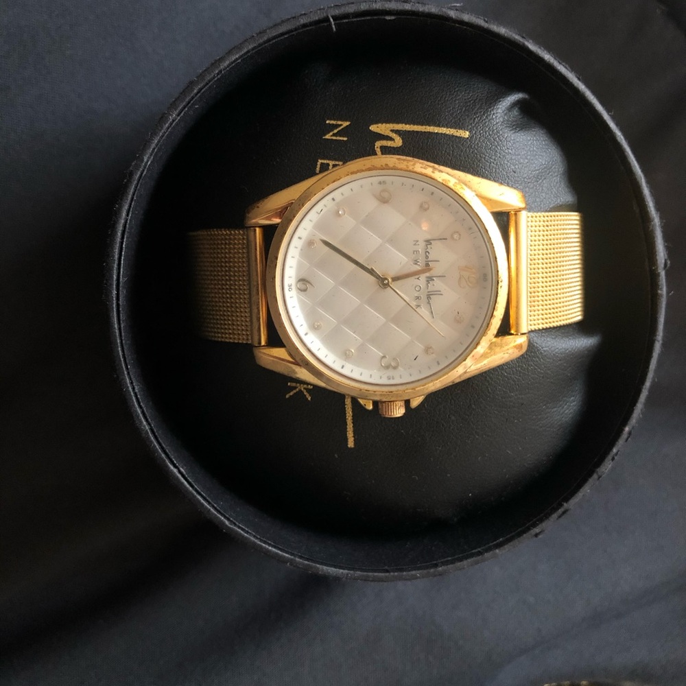 Women’s gold Nicole Miller watch
